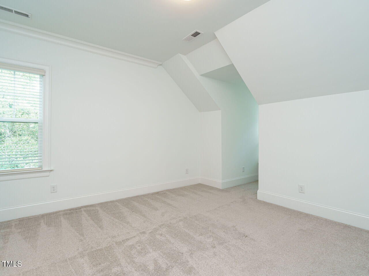 4405 Boxwood Road Raleigh, NC 27612 - Photo 32 of 58 an empty room with a window