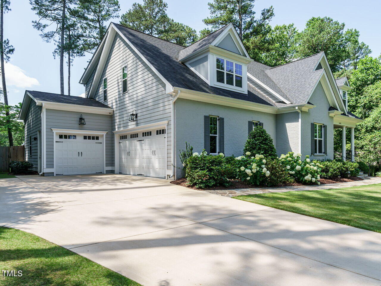 4405 Boxwood Road Raleigh, NC 27612 - Photo 4 of 58 a front view of a house with a yard and garage