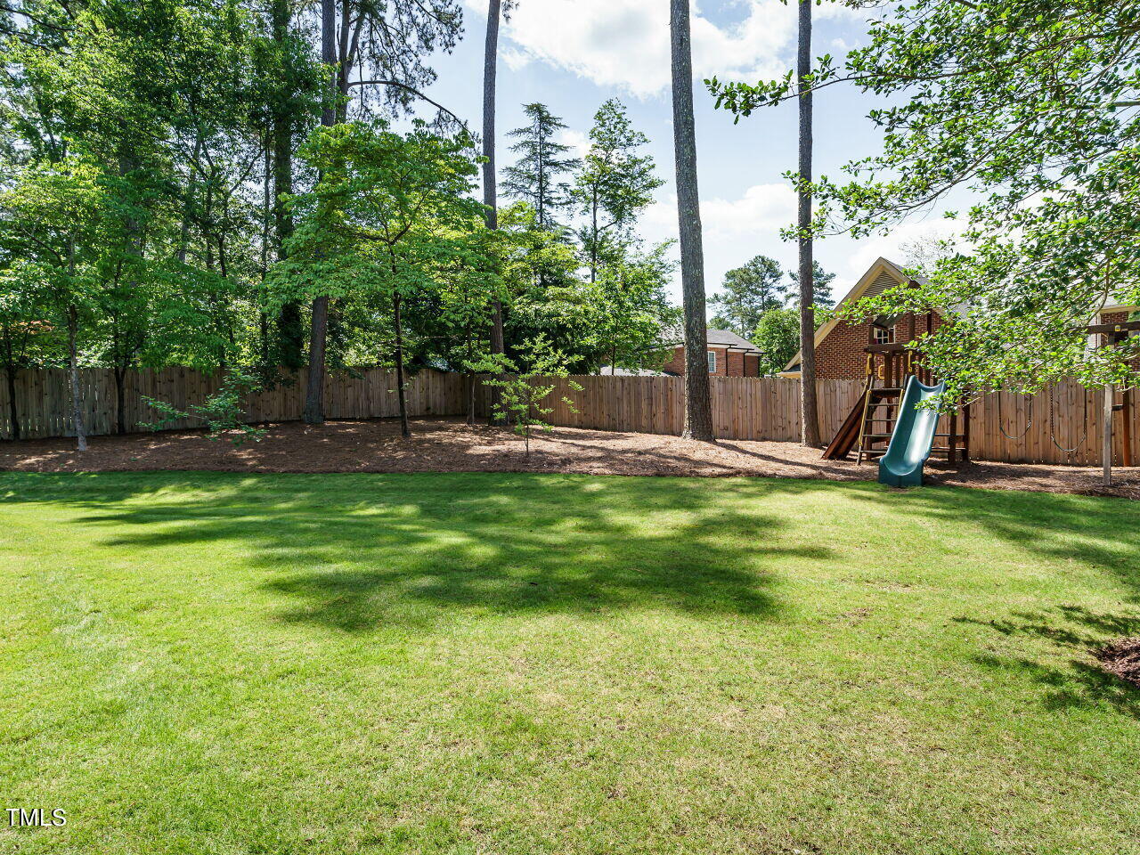4405 Boxwood Road Raleigh, NC 27612 - Photo 41 of 58 a view of a backyard with palm trees