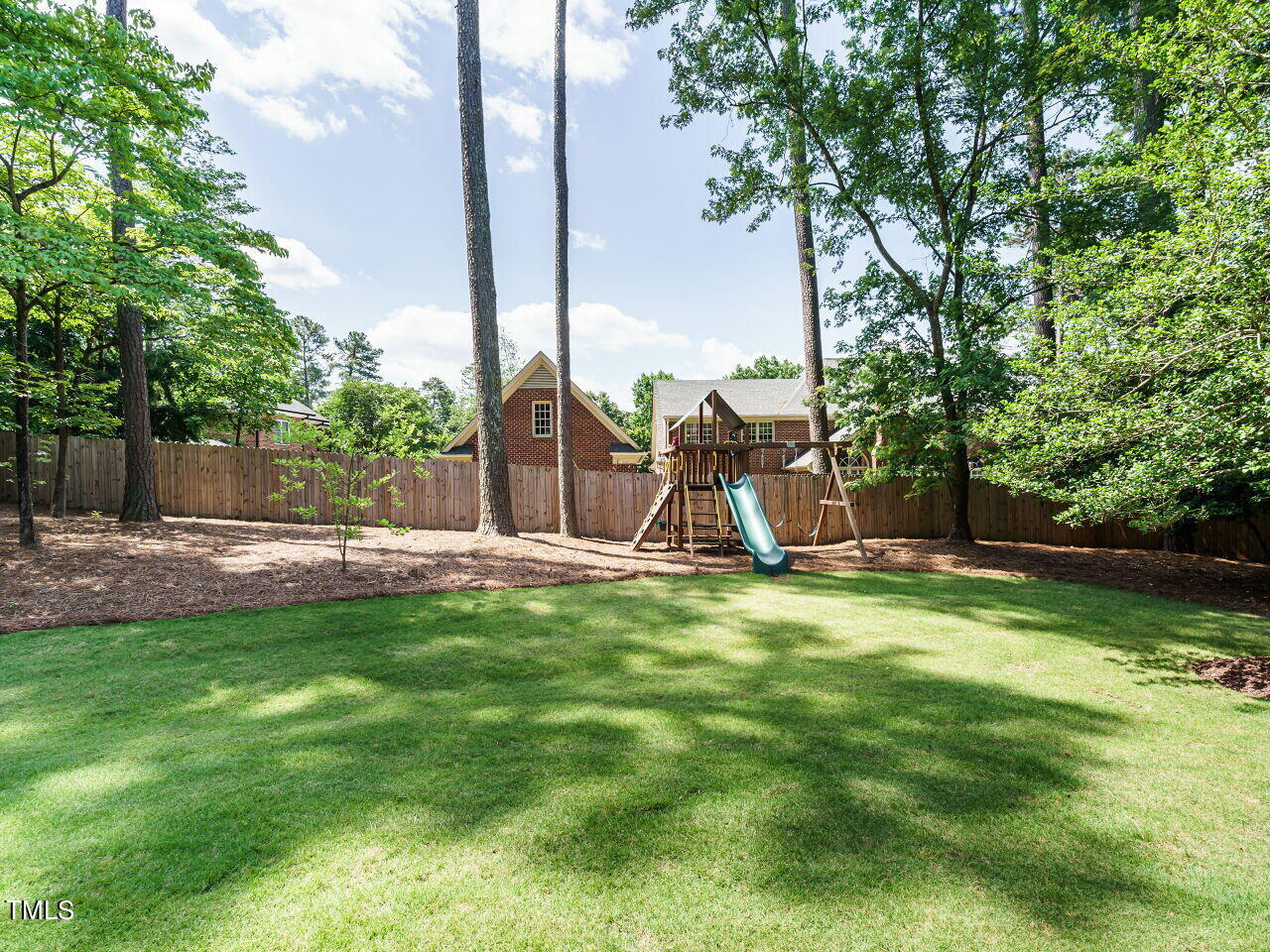 4405 Boxwood Road Raleigh, NC 27612 - Photo 42 of 58 a view of a park with a slide