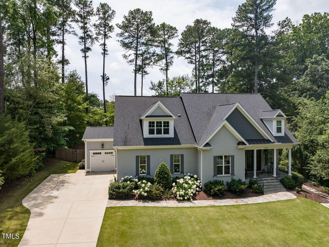 4405 Boxwood Road Raleigh, NC 27612 - Photo 47 of 58 a front view of a house with a yard and potted plants