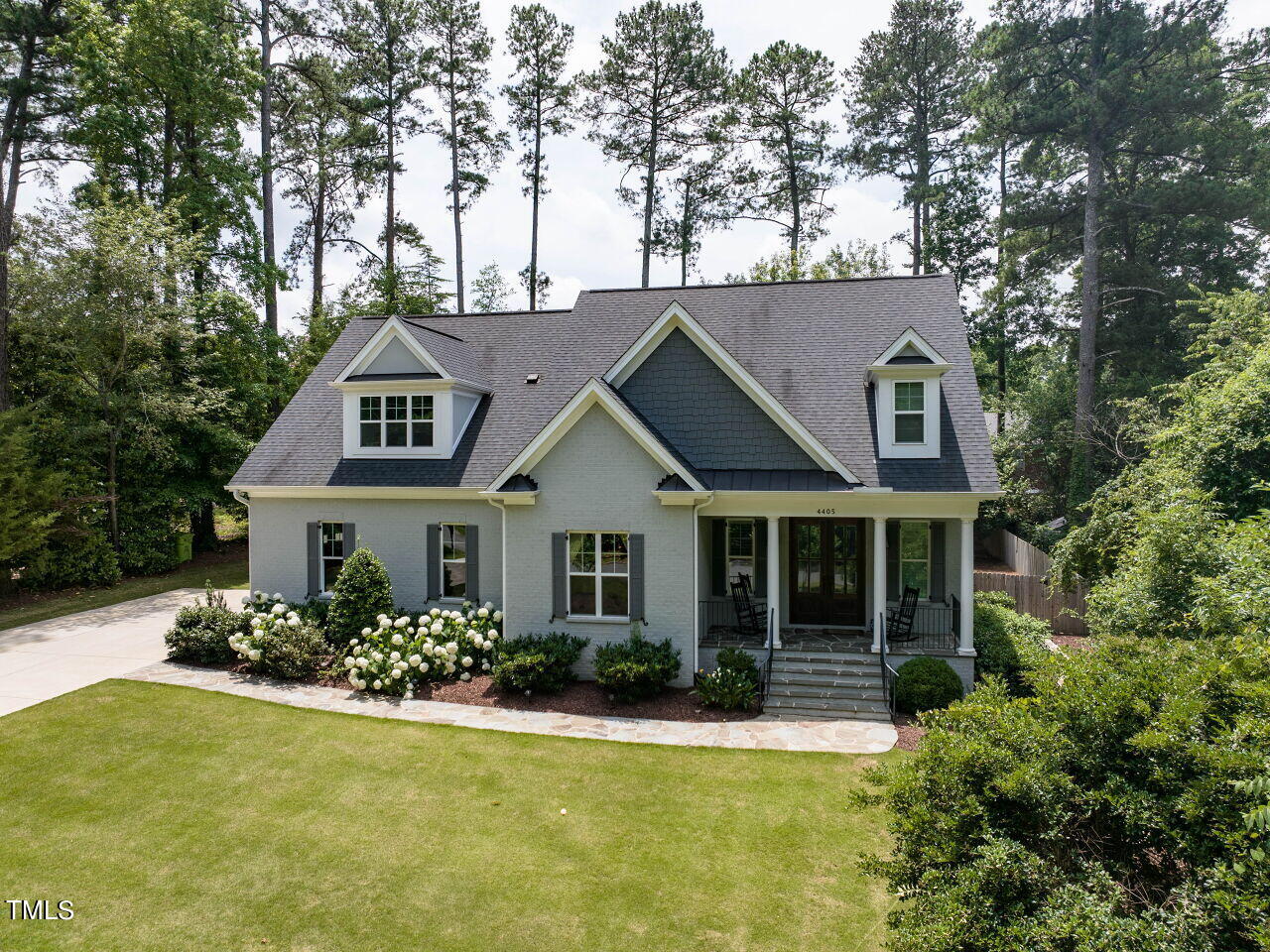 4405 Boxwood Road Raleigh, NC 27612 - Photo 48 of 58 a front view of a house with a yard and garage