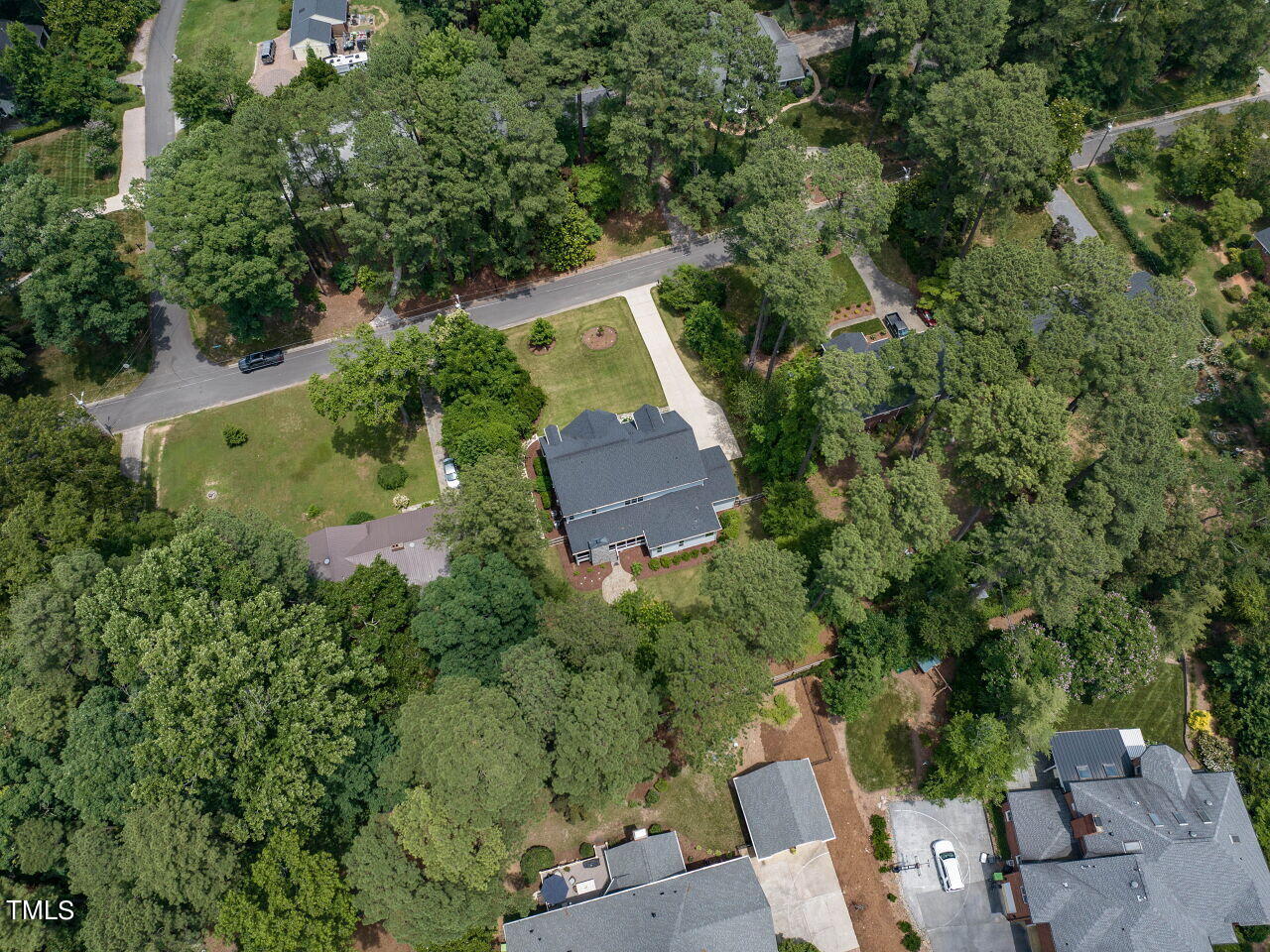 4405 Boxwood Road Raleigh, NC 27612 - Photo 53 of 58 an aerial view of a house with a yard and lake view