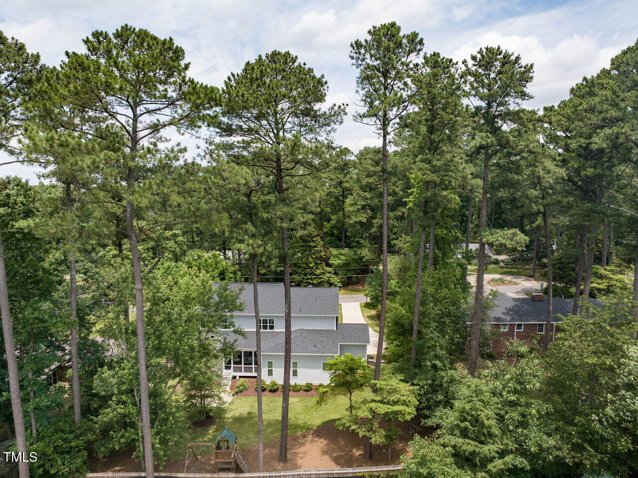 4405 Boxwood Road Raleigh, NC 27612 - Photo 54 of 58 an aerial view of a house with yard and outdoor seating