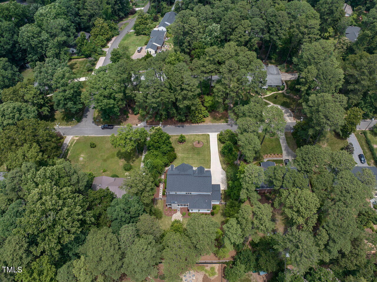 4405 Boxwood Road Raleigh, NC 27612 - Photo 56 of 58 an aerial view of a house with a yard and large trees