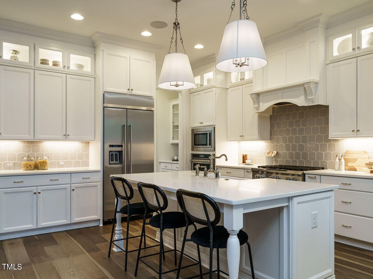 4405 Boxwood Road Raleigh, NC 27612 - Photo 9 of 58 a kitchen with granite countertop a sink cabinets and refrigerator