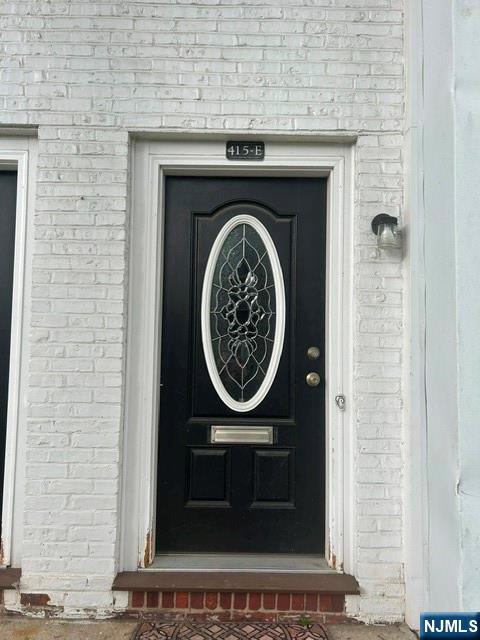 415 Ridge Road, Unit E North Arlington, NJ 07031 - Photo 1 of 6 a close view of a fireplace in a room