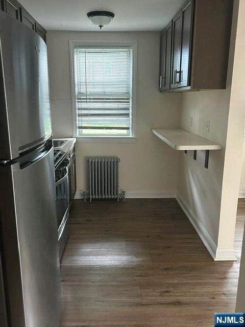 415 Ridge Road, Unit E North Arlington, NJ 07031 - Photo 3 of 6 a kitchen with a refrigerator and window