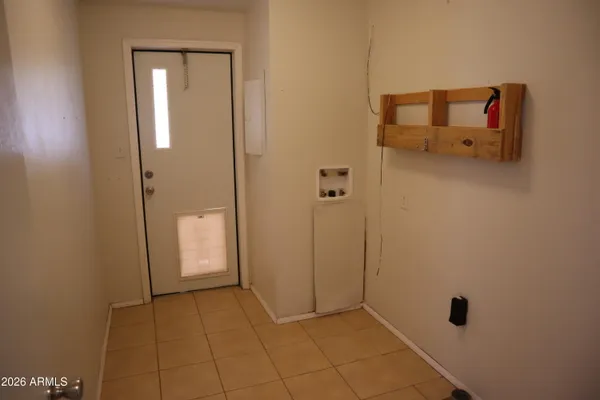 a view of empty room with wooden floor and fireplace