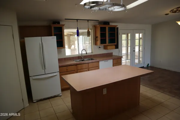 a kitchen with stainless steel appliances a refrigerator and a stove