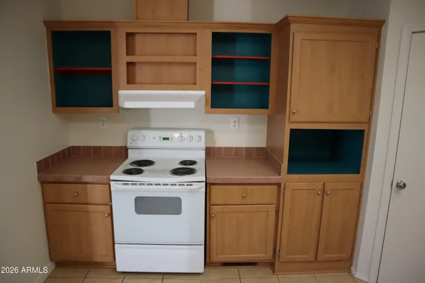 a utility room with dryer washer and a refrigerator
