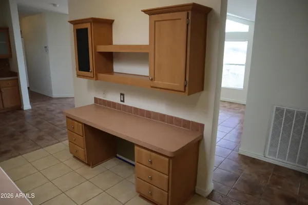 a room with cabinets and a wooden floor