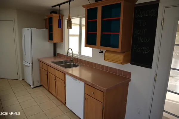 a kitchen with a sink and a refrigerator