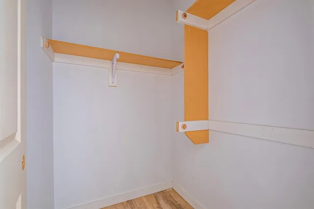 a bathroom with a granite countertop sink and mirror
