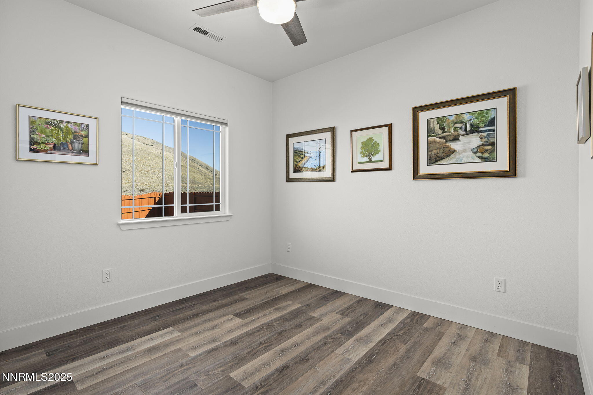 1075 West Slab Cliffs Reno, NV 89508 - Photo 12 of 22 a view of empty room with wooden floor