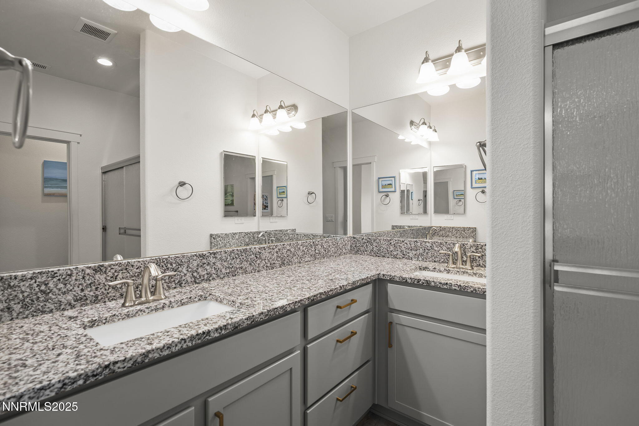 1075 West Slab Cliffs Reno, NV 89508 - Photo 17 of 22 a bathroom with a granite countertop sink and a mirror