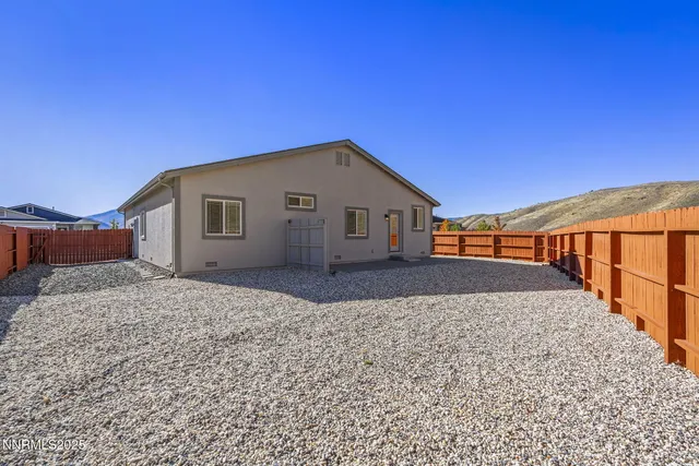 a backyard of a house with wooden floor