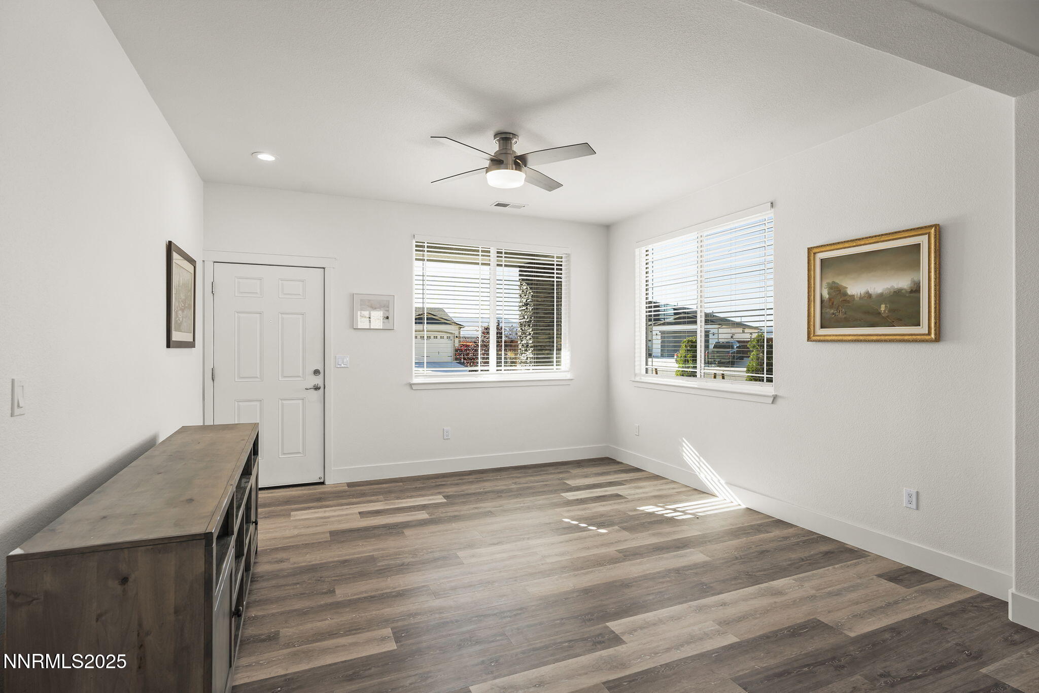 1075 West Slab Cliffs Reno, NV 89508 - Photo 3 of 22 a view of a livingroom with wooden floor and a window