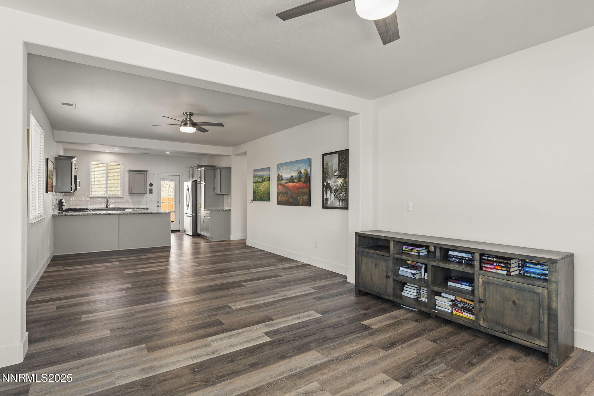 1075 West Slab Cliffs Reno, NV 89508 - Photo 5 of 22 a view of an empty room with window and wooden floor