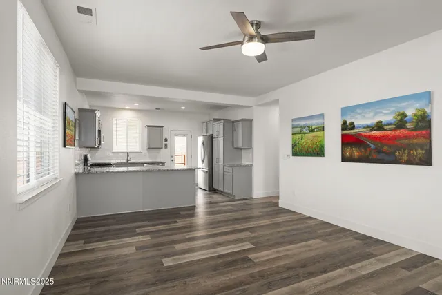a view of kitchen with wooden floor and window