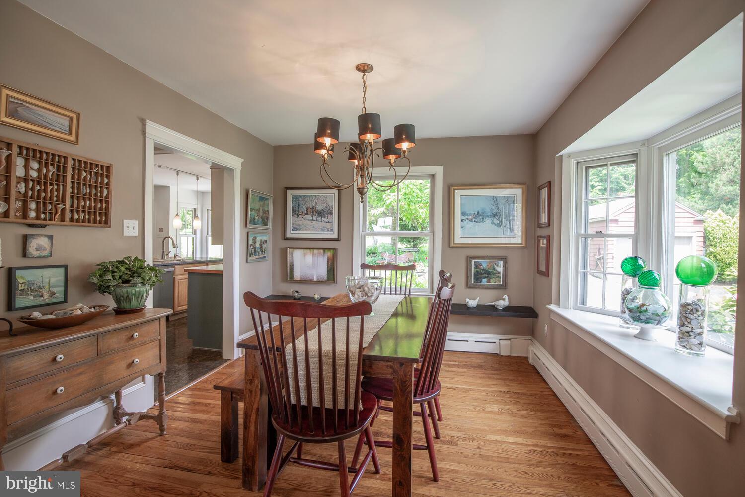 4367 Curly Hill Road Doylestown, PA 18902 - Photo 20 of 72 a view of a dining room with furniture a livingroom and chandelier