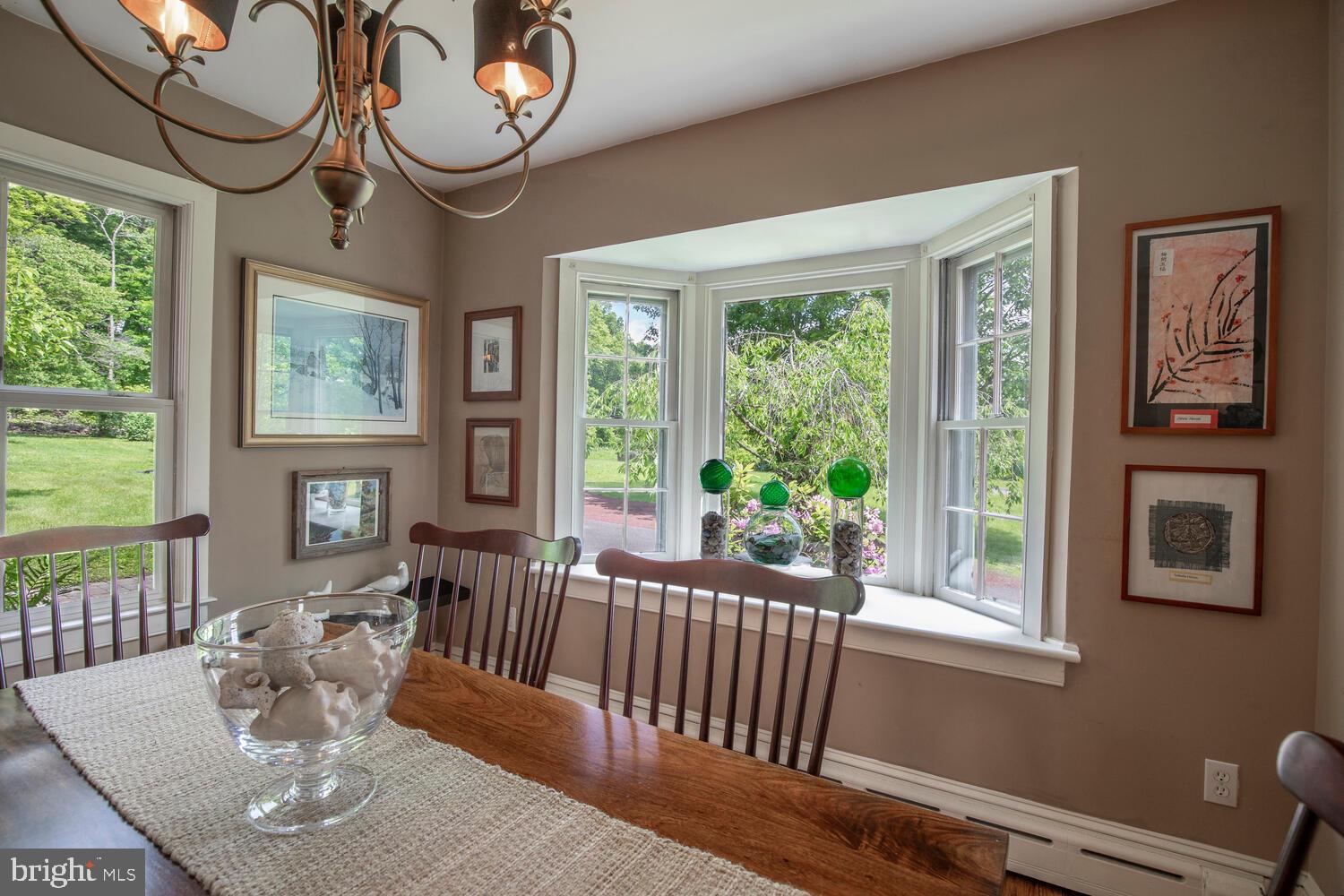 4367 Curly Hill Road Doylestown, PA 18902 - Photo 21 of 72 a view of a dining room with furniture window and wooden floor