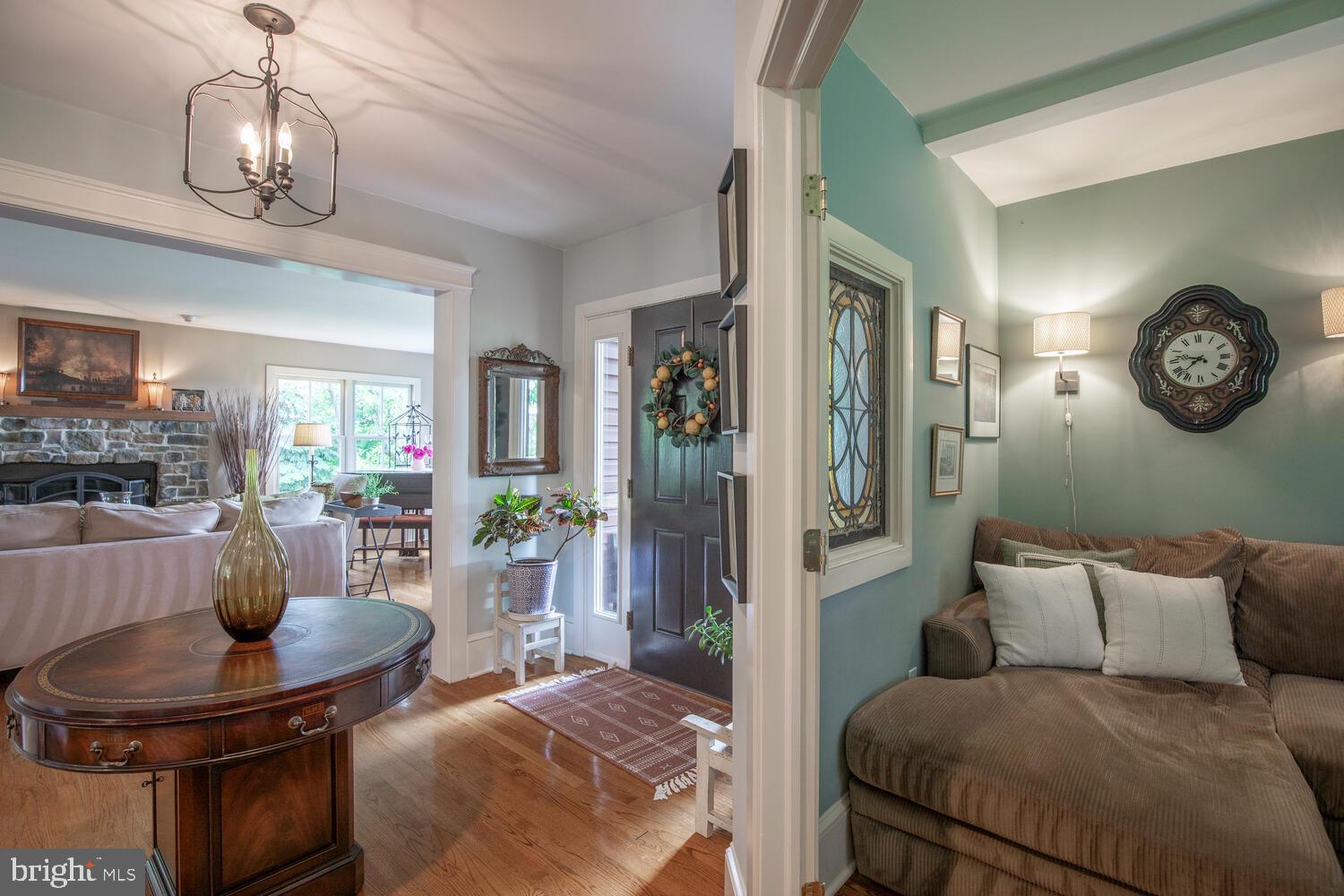 4367 Curly Hill Road Doylestown, PA 18902 - Photo 25 of 72 a living room with furniture a chandelier and a dining table