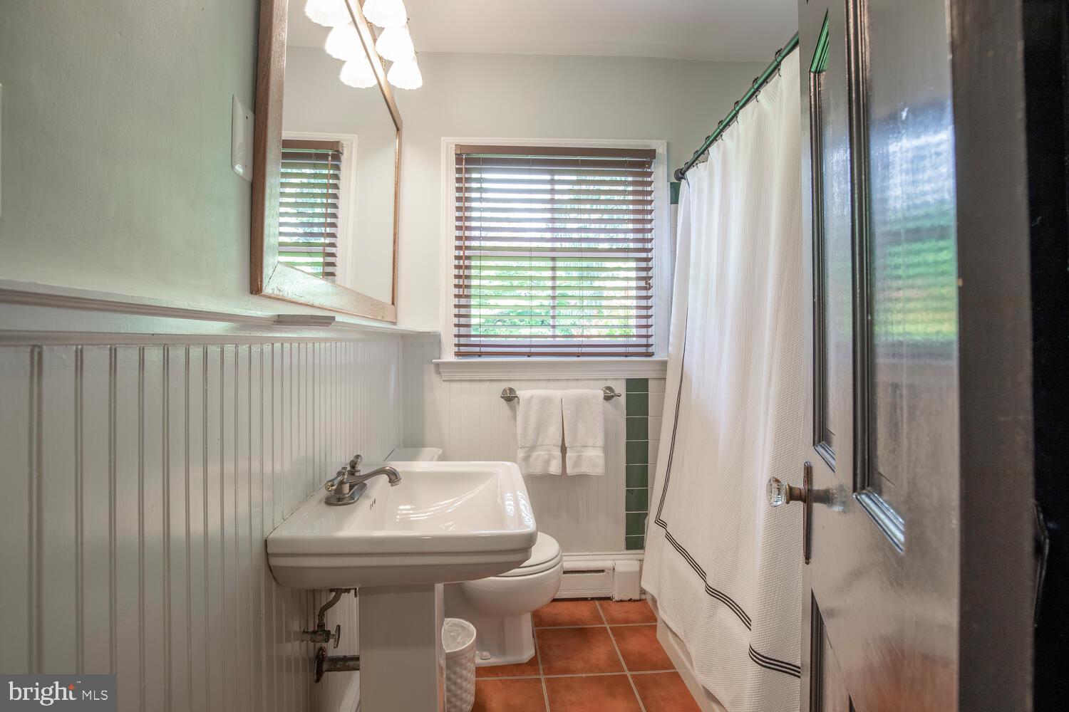 4367 Curly Hill Road Doylestown, PA 18902 - Photo 29 of 72 a bathroom with a sink a toilet and a shower