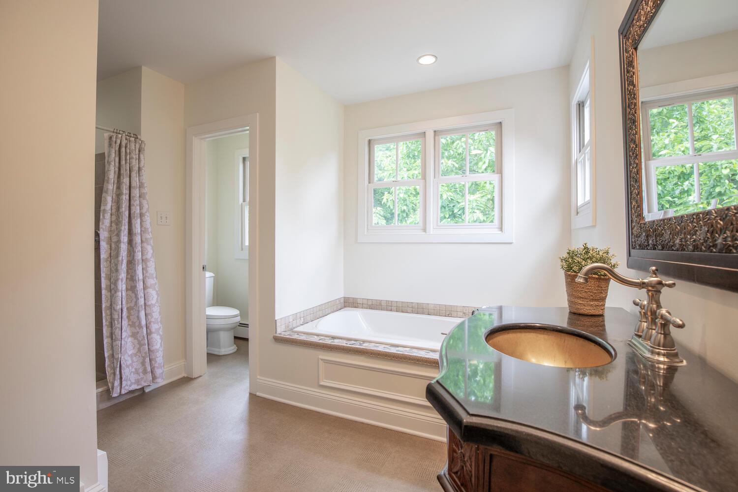 4367 Curly Hill Road Doylestown, PA 18902 - Photo 40 of 72 a bathroom with a sink and a mirror