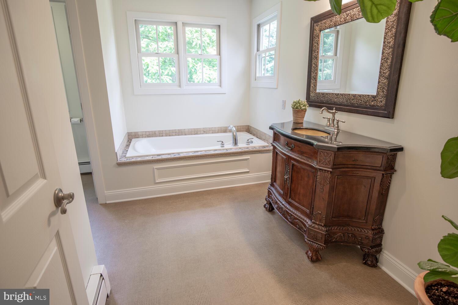 4367 Curly Hill Road Doylestown, PA 18902 - Photo 41 of 72 a bathroom with a sink a toilet and a bathtub
