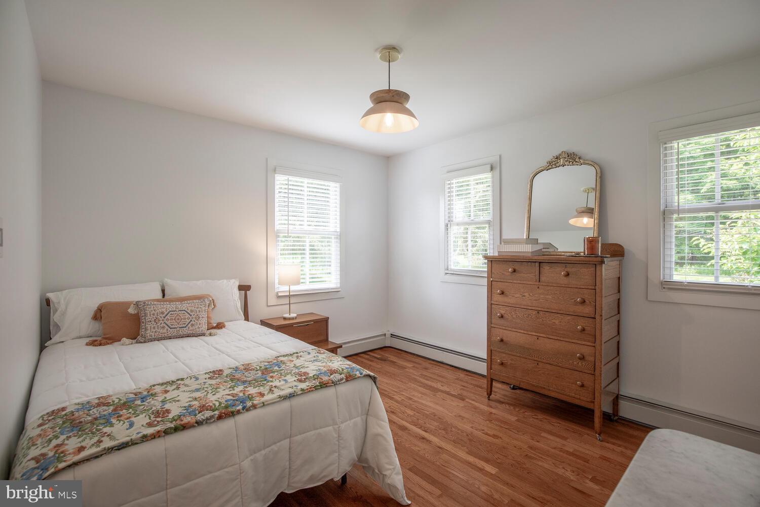 4367 Curly Hill Road Doylestown, PA 18902 - Photo 46 of 72 a bedroom with a bed and a dresser