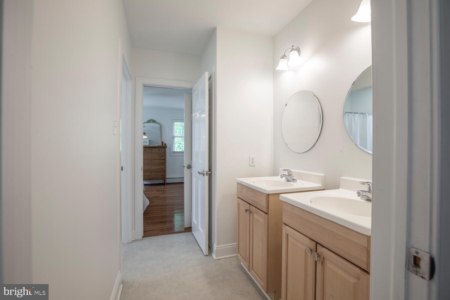 4367 Curly Hill Road Doylestown, PA 18902 - Photo 47 of 72 a bathroom with a sink and a mirror