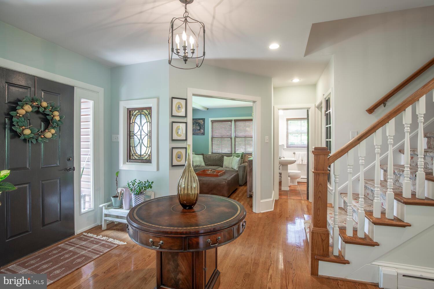 4367 Curly Hill Road Doylestown, PA 18902 - Photo 5 of 72 a living room with furniture and a chandelier