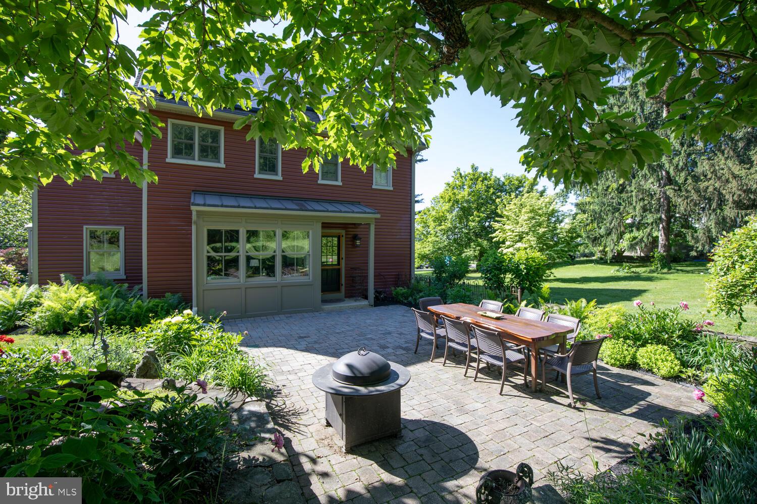 4367 Curly Hill Road Doylestown, PA 18902 - Photo 53 of 72 a view of a patio with table and chairs potted plants and large tree