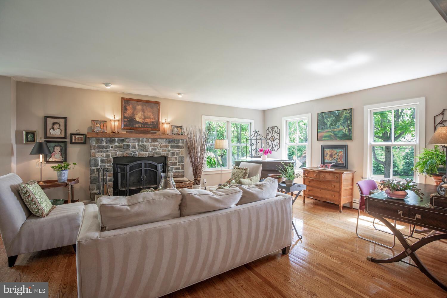 4367 Curly Hill Road Doylestown, PA 18902 - Photo 7 of 72 a living room with furniture and a fireplace