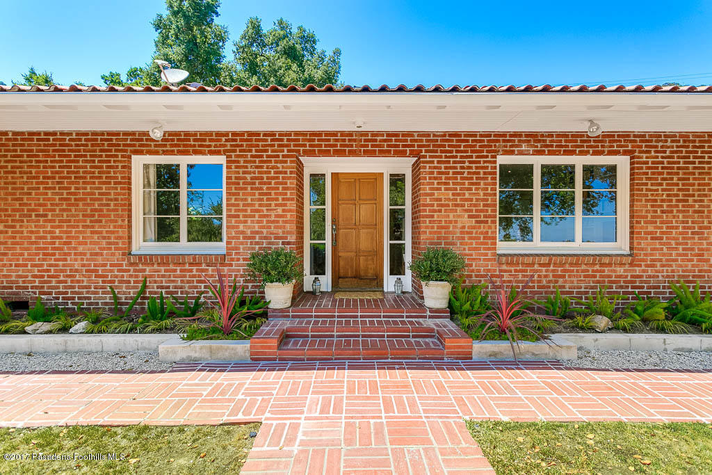 1336 Inverness Drive Pasadena, CA 91103 - Photo 2 of 42 a front view of a house with a yard and outdoor seating