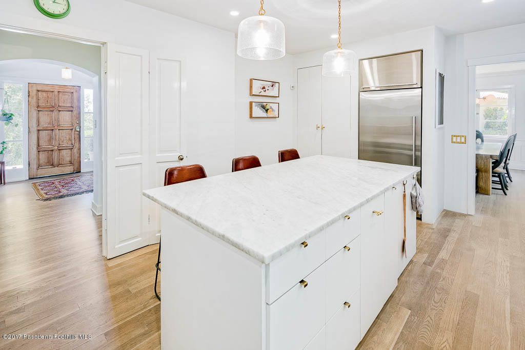 1336 Inverness Drive Pasadena, CA 91103 - Photo 19 of 42 a kitchen with a refrigerator a sink and wooden floor