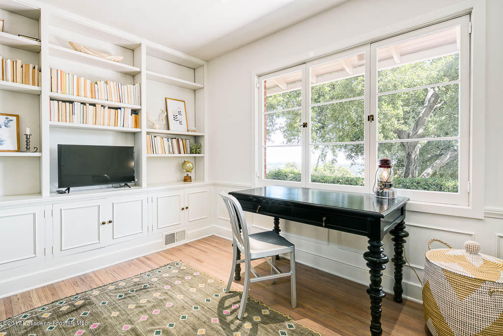 1336 Inverness Drive Pasadena, CA 91103 - Photo 20 of 42 a living room with furniture a flat screen tv and a floor to ceiling window