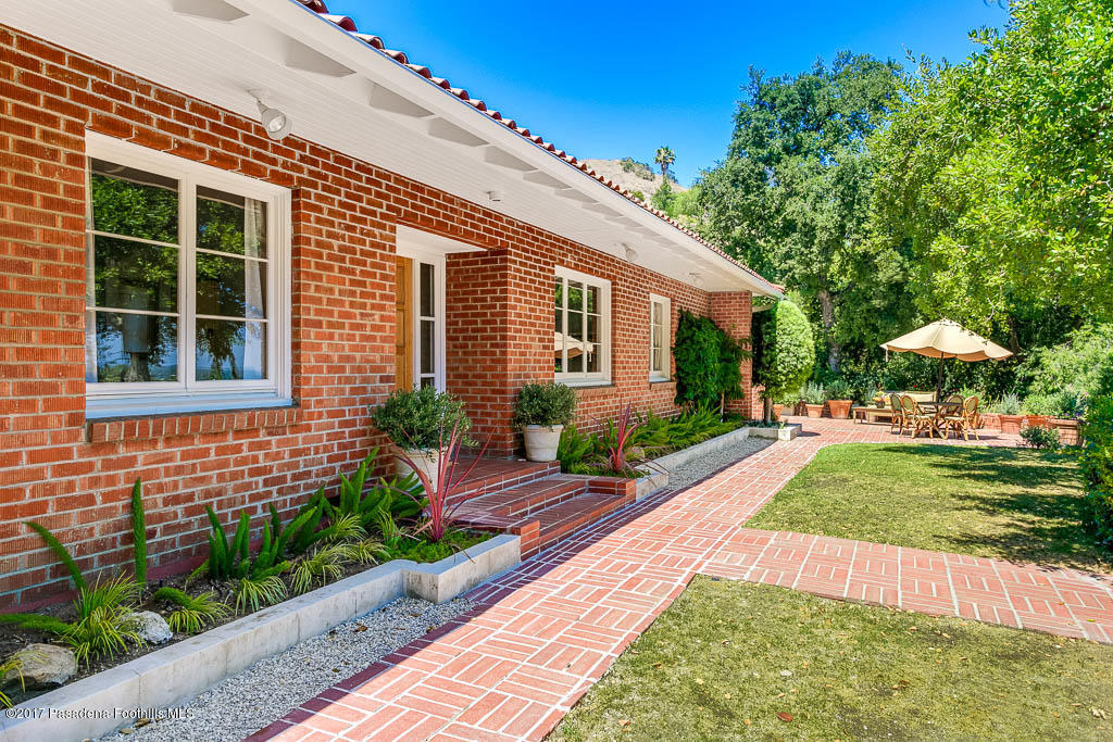 1336 Inverness Drive Pasadena, CA 91103 - Photo 3 of 42 a front view of a house with a yard and porch