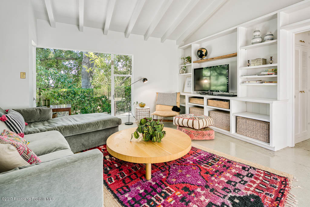 1336 Inverness Drive Pasadena, CA 91103 - Photo 25 of 42 a living room with furniture a flat screen tv and a large window