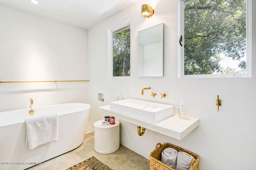 1336 Inverness Drive Pasadena, CA 91103 - Photo 30 of 42 a bathroom with a sink and a mirror