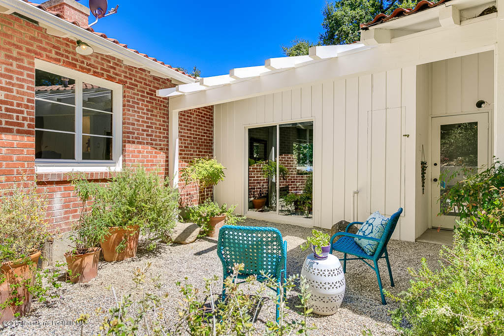 1336 Inverness Drive Pasadena, CA 91103 - Photo 32 of 42 a view of a patio with couple of chairs and potted plants
