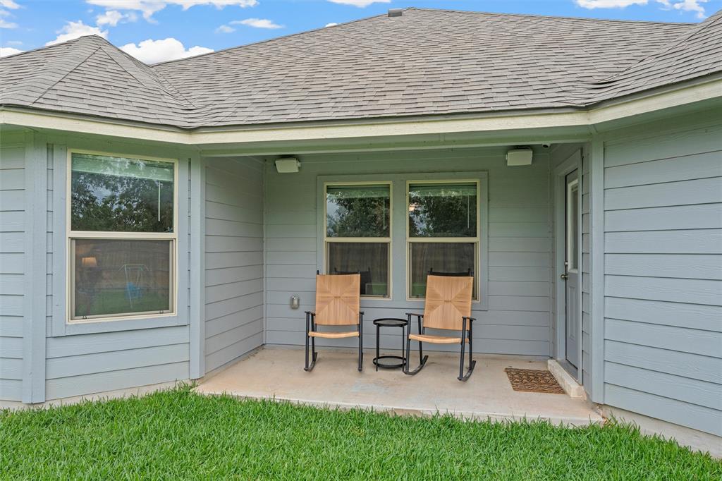 10712 Peperak Court Waco, TX 76708 - Photo 21 of 25 a house that has sitting area in front of it