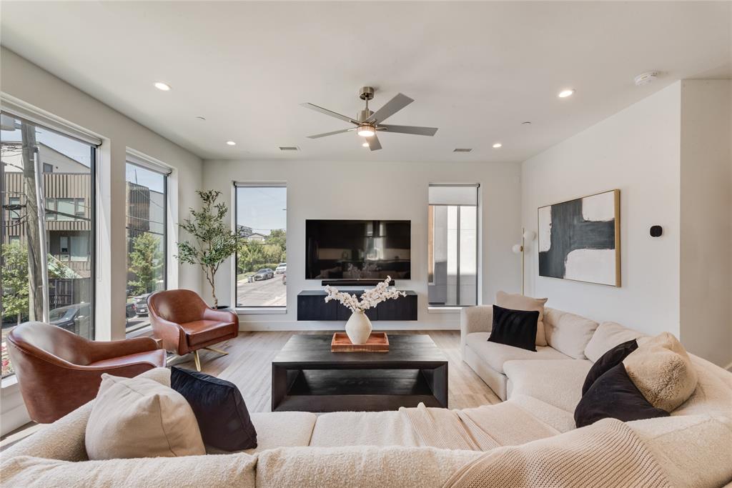 a living room with furniture or outdoor view and a large window