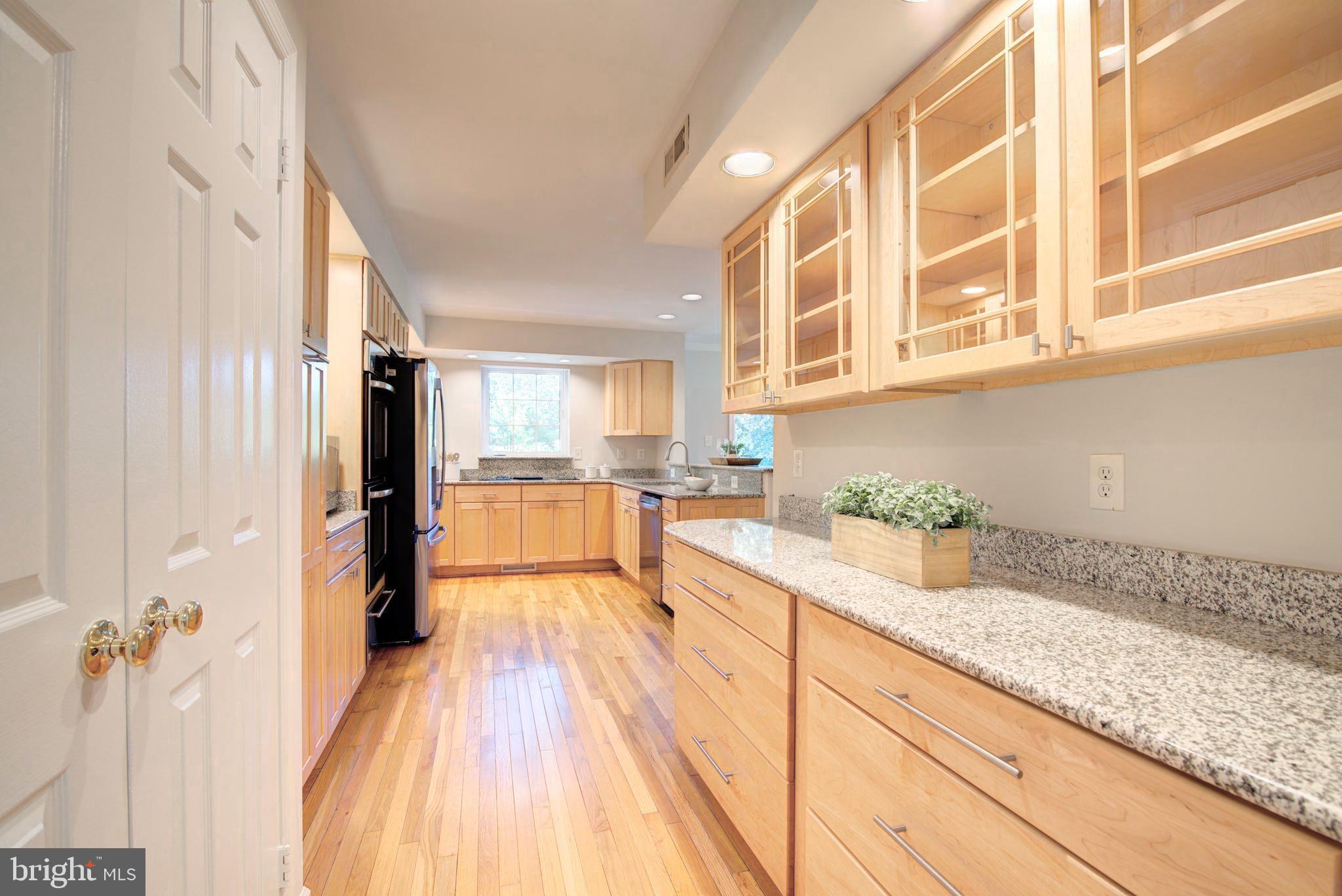 2128 Golf Course Drive Reston, VA 20191 - Photo 10 of 105 Butlers pantry with glass front maple cabinetry