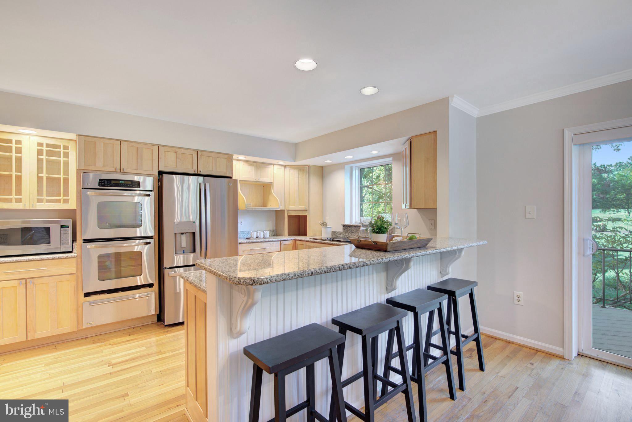 2128 Golf Course Drive Reston, VA 20191 - Photo 18 of 105 Bar for extra seating and chats while cooking
