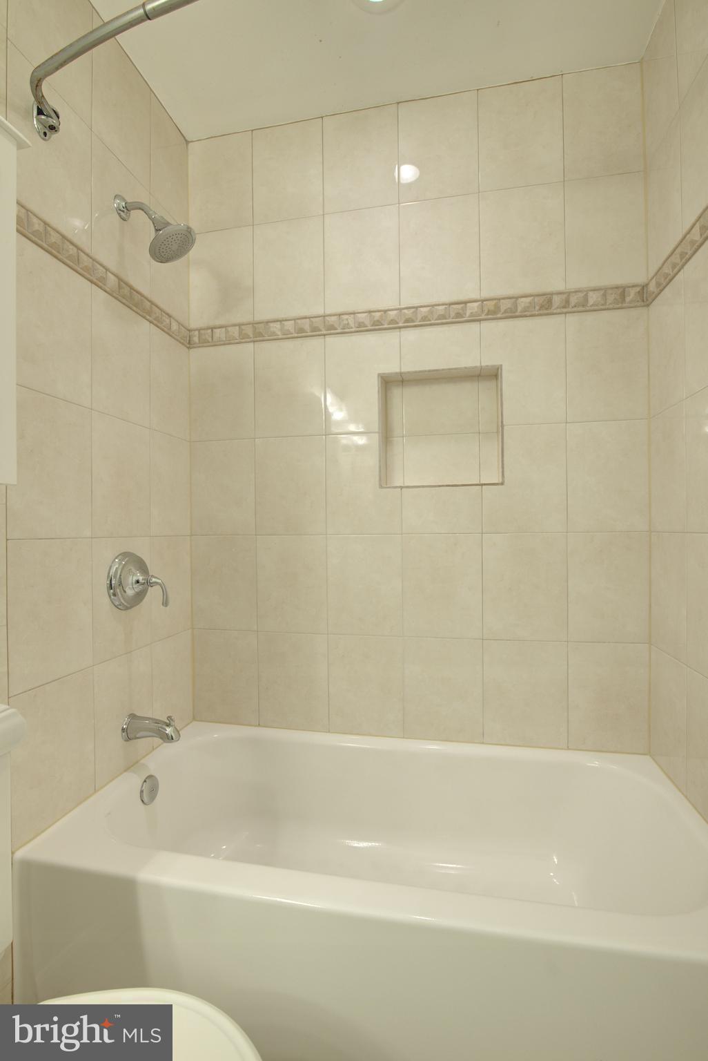 2128 Golf Course Drive Reston, VA 20191 - Photo 49 of 105 Custom tile in tub/shower