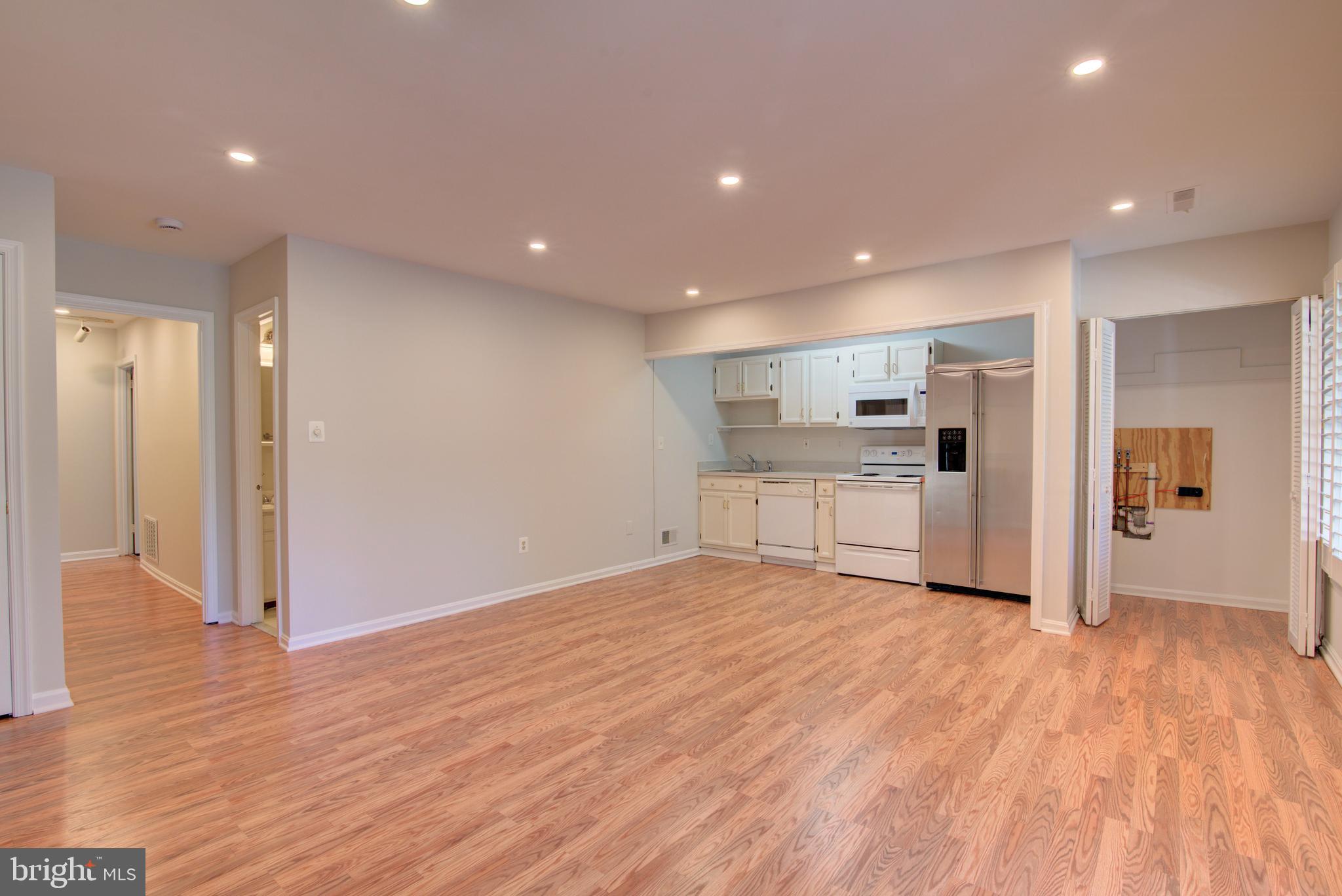 2128 Golf Course Drive Reston, VA 20191 - Photo 59 of 105 Dining/ Living rms and laundry hook up in closet