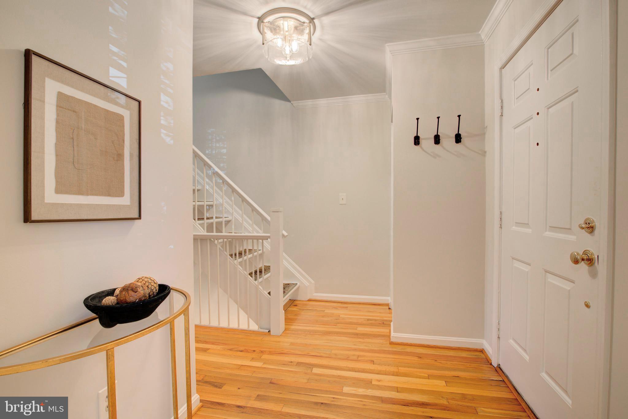 2128 Golf Course Drive Reston, VA 20191 - Photo 7 of 105 Freshly painted foyer w/hardwood floors