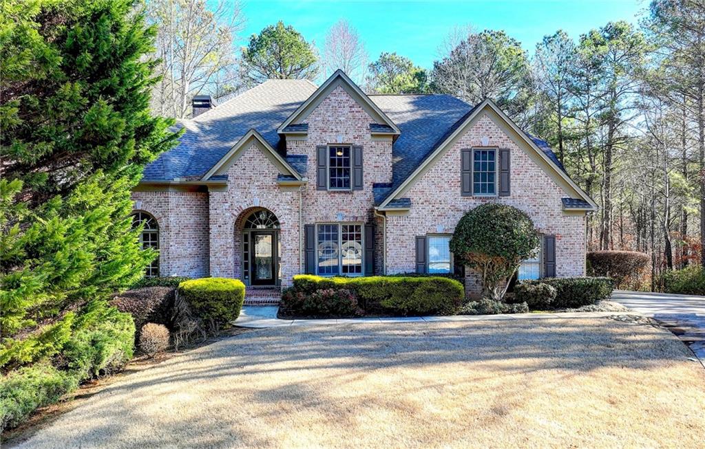 6625 Callanwalde Court Suwanee, GA 30024 - Photo 1 of 1 a front view of a house with a yard